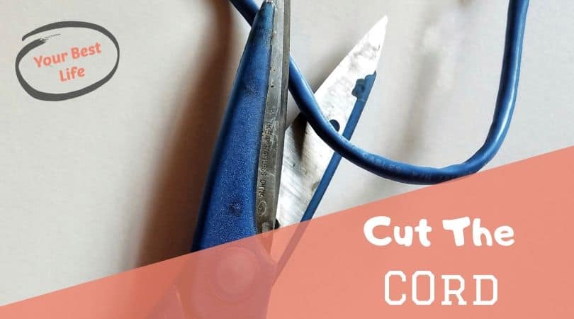 blue scissors cutting a blue cord